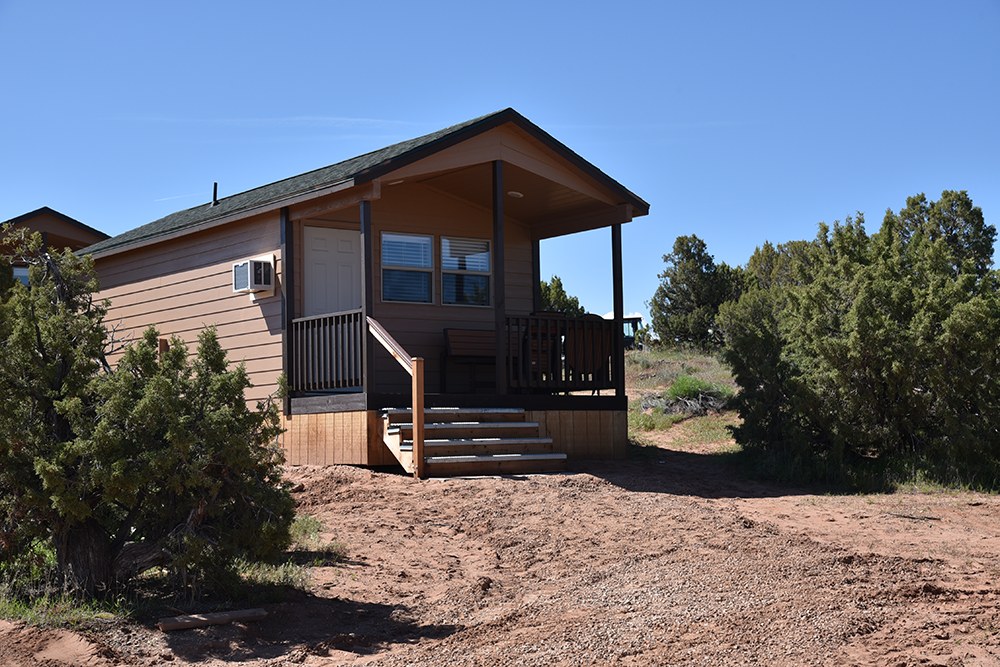 Camper cabin with covered porch