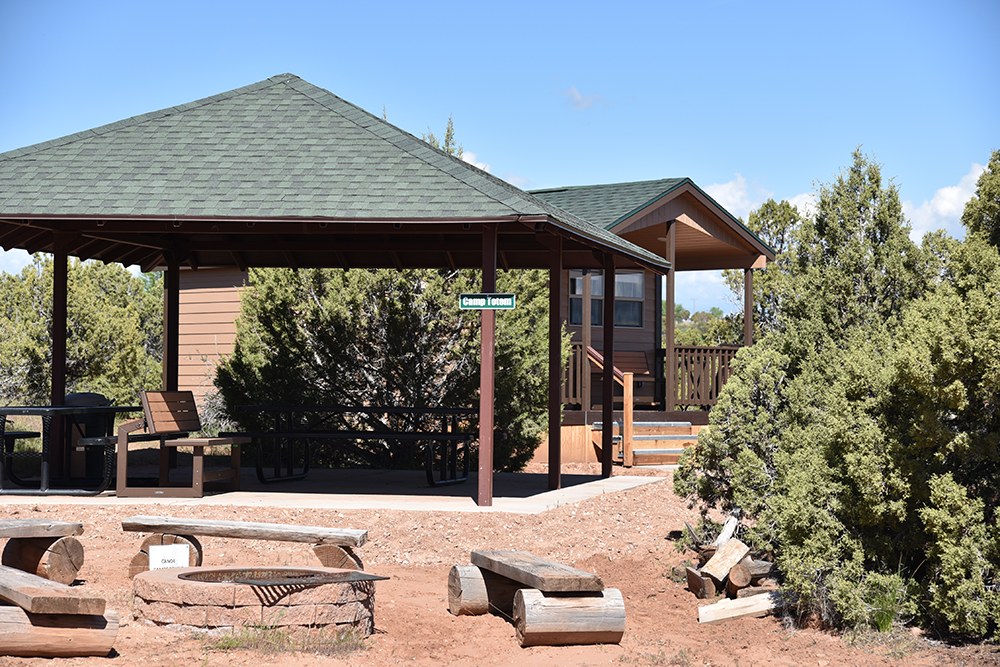 Covered campground pavilion with picnic tables